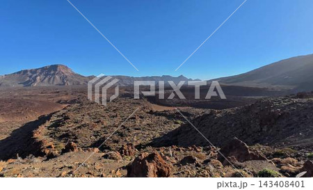 An Absolutely Stunning Volcanic Landscape Set Against a Beautiful, Clear, and Bright Sky Above 143408401