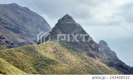 The Majestic Mountain Peak is beautifully surrounded by lush, vibrant greenery and nature 143408532