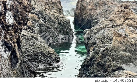 Experience a stunning and beautiful scenic Rocky Waterway that flows among the Coastal Cliffs Experience a stunning and beautiful scenic Rocky Waterway that flows among the Coastal Cliffs 143408551