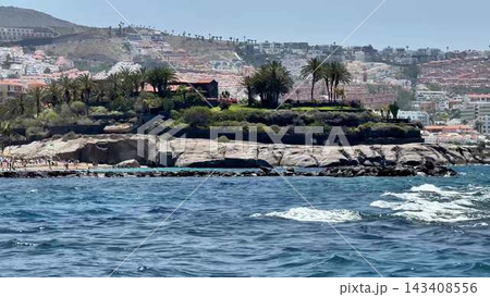 A Beautiful and Stunning Coastal Landscape Featuring a Lush Island and a Scenic Background 143408556