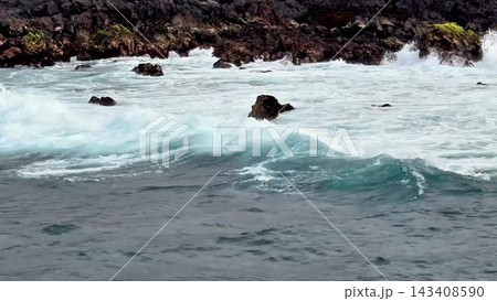 A Rugged Shoreline That Features Waves Relentlessly Crashing Violently Against Rocky Outcrops 143408590