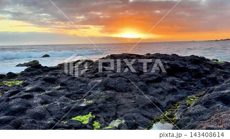 A Vibrant Sunset Over a Rocky Shoreline Capturing Natures Stunning Beauty and Serenity A Vibrant Sunset Over a Rocky Shoreline Capturing Natures Stunning Beauty and Serenity 143408614