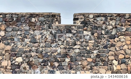 An exquisite Rustic Stone Wall featuring a Window along with various Architectural Features An exquisite Rustic Stone Wall featuring a Window along with various Architectural Features 143408616