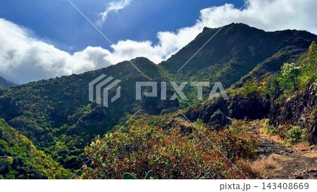 Stunning and Breathtaking Mountain Landscape Featuring Lush Greenery and Clear Blue Skies 143408669