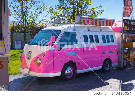 Yatsushiro, Kumamoto Pref, Japan - Oct 9 2024, close-up view of a parked kei car decorated like a pink Volkswagen minivan, without people, at daytime, Yatsushiro, Japan 143410054