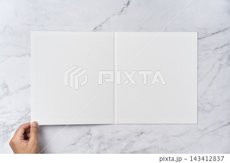 Top view sequence from open to close blank white greeting card mockup on marble background with copy space : hand opening a blank white folded greeting card Top view sequence from open to close blank white greeting card mockup on marble background with copy space : hand opening a blank white folded greeting card 143412837