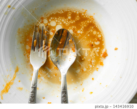 Dirty plate top view background, finished eat dinner in restautant, abstract textuer stain smearing drip sauce bbq jam chilli jelly on ceramic breakfast, concept for clean hyginene product. Dirty plate top view background, finished eat dinner in restautant, abstract textuer stain smearing drip sauce bbq jam chilli jelly on ceramic breakfast, concept for clean hyginene product. 143416910