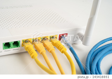 Ethernet cable with wireless router connect to internet service provider network. Ethernet cable with wireless router connect to internet service provider network. 143416931