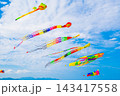 Flying colorful kites in blue sky. Kite Festival 143417558