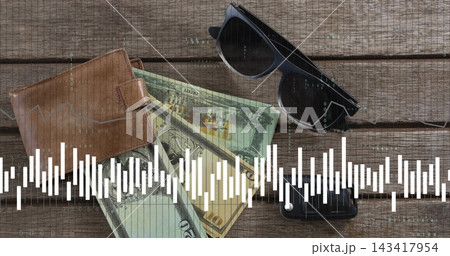 Showing bifold wallet revealing US bills on wood table, with shades phone and waveform code overlay 143417954