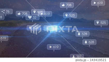 Glowing notification bubbles floating on beach at night, showing numeric badges and blue burst 143419521