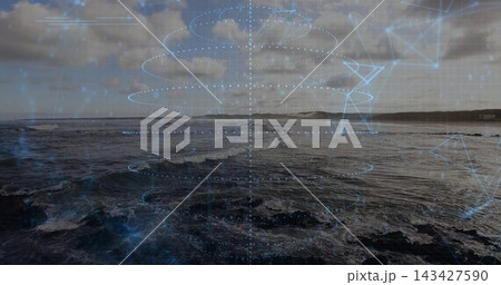 Displaying coastal seascape showing churning waves over rocky shoreline with holographic overlay Displaying coastal seascape showing churning waves over rocky shoreline with holographic overlay 143427590