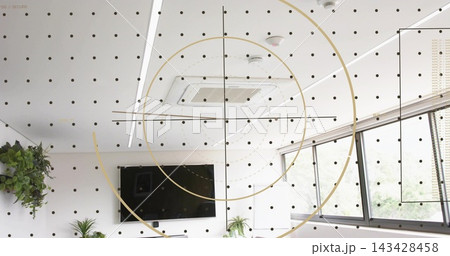 Displaying concentric gold rings and dotted grid across office with TV, vent, lights, windows 143428458