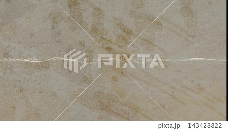 Displaying stone slab in close-up with white dotted waveform line across center, dark edges 143428822