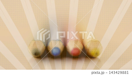 Displaying four hex wooden colored pencils lined on sunburst paper with green blue red yellow cores Displaying four hex wooden colored pencils lined on sunburst paper with green blue red yellow cores 143429881