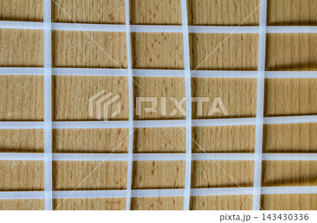 Wooden surface with white grid pattern and lines Wooden surface with white grid pattern and lines 143430336