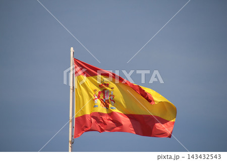 Flag of Spain aganist blue sky 143432543
