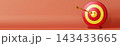 A target symbol is placed on a plain surface representing finance. An arrow is hitting the center, showing achievement. There is room for text around 143433665