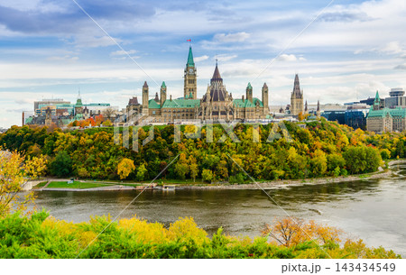 Ottawa Parliament Hill in autumn with colorful foliage and Ottawa river view in Canada Ottawa Parliament Hill in autumn with colorful foliage and Ottawa river view in Canada 143434549