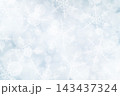 A Christmas background with bokeh and small snowflakes 143437324