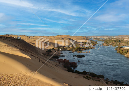 Nile river flowing through desert landscape in aswan 143437702