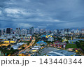 Dark clouds gather over Kuala Lumpur cityscape at dusk 143440344