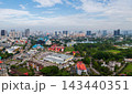 Aerial view of Kuala Lumpur cityscape with lush greenery and urban skyline 143440351