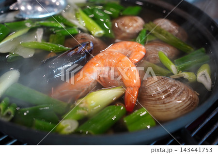 Korean Seafood Noodle Soup Kalguksu with Clams and Shrimp Korean Seafood Noodle Soup Kalguksu with Clams and Shrimp 143441753