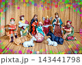 Nativity Scene With Figurines of Mary, Joseph, Baby Jesus, and Animals Set on a Textured Surface With Colorful Decorations 143441798