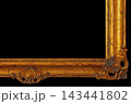 Golden Frame With Ornate Design Set Against a Black Background Focusing on Texture and Details 143441802