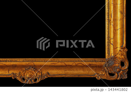 Golden Frame With Ornate Design Set Against a Black Background Focusing on Texture and Details Golden Frame With Ornate Design Set Against a Black Background Focusing on Texture and Details 143441802