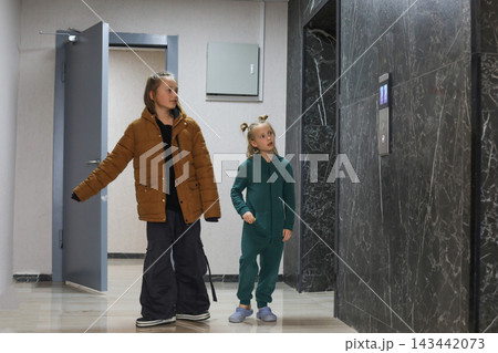Pretty children getting ready to walk the dog Pretty children getting ready to walk the dog 143442073