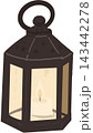 A lantern with glowing candle inside featuring a dark vintage frame and warm soft light for Halloween night. 143442278