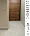 Modern wooden sliding door wardrobe in apartment hallway. 143442397