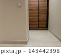 Minimalist hallway interior with built-in wooden closet. 143442398