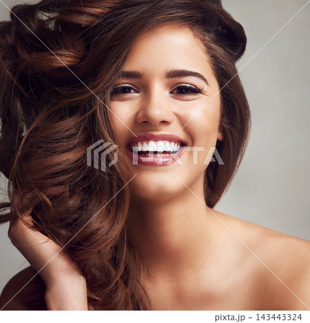 Beauty, hair and happy with portrait of woman in studio on gray background for keratin or shampoo treatment. Aesthetic, cosmetics and smile with confident model at salon for conditioning or haircare Beauty, hair and happy with portrait of woman in studio on gray background for keratin or shampoo treatment. Aesthetic, cosmetics and smile with confident model at salon for conditioning or haircare 143443324
