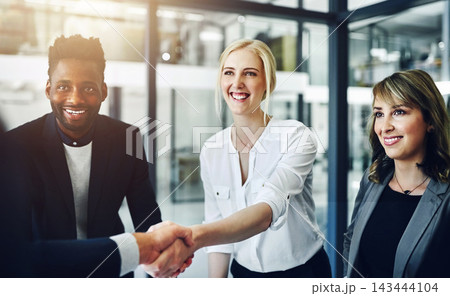 Handshake, meeting and welcome with business people in boardroom of office for agreement or deal. B2B, partnership and thank you with employee team in workplace for corporate diversity or success 143444104