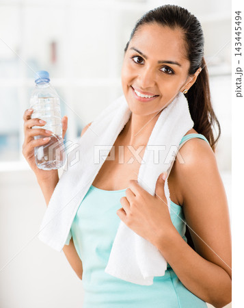Athlete, portrait and woman for fitness with towel, training and sports for health with water. Face, bottle and strong female person in sportswear and sweat cloth, exercise or performance in studio Athlete, portrait and woman for fitness with towel, training and sports for health with water. Face, bottle and strong female person in sportswear and sweat cloth, exercise or performance in studio 143445494