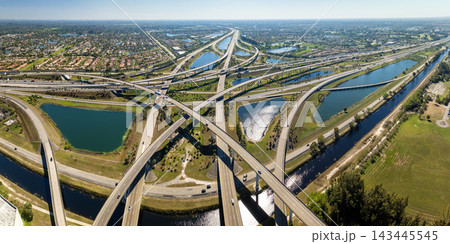 Elevated freeway intersection in American city of Miami, Florida with fast moving cars. USA transportation infrastructure concept 143445545