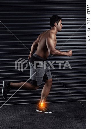 Sports, gym and man with ankle injury, accident or medical emergency for pain in training. Red glow, athlete and body of male person with muscle sprain in leg for cardio workout in fitness center. 143445775