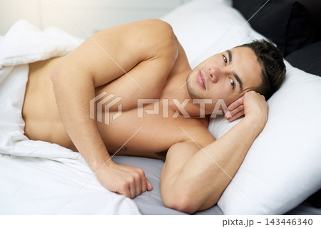 Man, bed and portrait in home at morning with student and relax while shirtless and calm. House, bedroom and awake gen z face on a mattress waking up from lazy rest on comfy linen with a break Man, bed and portrait in home at morning with student and relax while shirtless and calm. House, bedroom and awake gen z face on a mattress waking up from lazy rest on comfy linen with a break 143446340