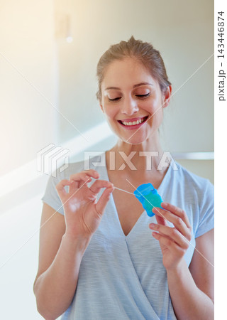 Woman, flossing and teeth with smile for dental or wellness, morning routine in bathroom for health. Person, cleaning and mouth for gum hygiene with oral tape, tooth with results for healthcare Woman, flossing and teeth with smile for dental or wellness, morning routine in bathroom for health. Person, cleaning and mouth for gum hygiene with oral tape, tooth with results for healthcare 143446874