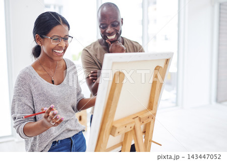 Woman, happy and instructor in studio as art creative for painting, inspiration and talent workshop by easel. Artist, laugh and advice with mentor by canvas for drawing, learning or idea in atelier Woman, happy and instructor in studio as art creative for painting, inspiration and talent workshop by easel. Artist, laugh and advice with mentor by canvas for drawing, learning or idea in atelier 143447052