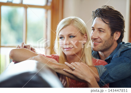 Happy, couple and hug on sofa for support, time and bonding together at home for marriage and trust. Smile, man and woman with love embrace on couch with vision for relationship, growth and relax Happy, couple and hug on sofa for support, time and bonding together at home for marriage and trust. Smile, man and woman with love embrace on couch with vision for relationship, growth and relax 143447851