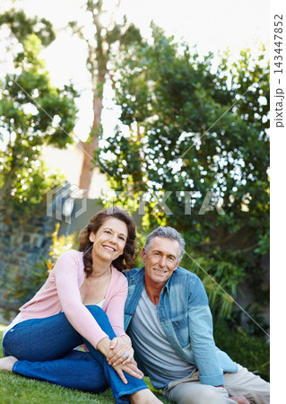 Park, portrait and mature couple on grass for picnic date with love, care and bonding together. Nature, happy marriage and garden with people and relax in summer with travel trip and vacation 143447852