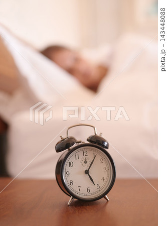 Sleeping, woman and closeup of alarm clock in bedroom with time for wake up, morning and snooze for wellness. Relax, dreaming and tired girl and watch with noise alert for late and lazy in apartment Sleeping, woman and closeup of alarm clock in bedroom with time for wake up, morning and snooze for wellness. Relax, dreaming and tired girl and watch with noise alert for late and lazy in apartment 143448088