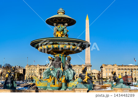 The ornate Fontaine des Mers and the Luxor Obelisk at Place de la Concorde under a clear blue sky in Paris, France 143448289