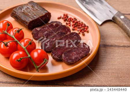 Sliced dry cured beef sausage or basturma with salt and spices. Sliced basturma 143448440