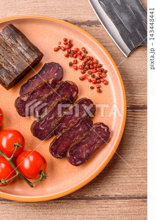 Sliced dry cured beef sausage or basturma with salt and spices. Sliced basturma 143448441