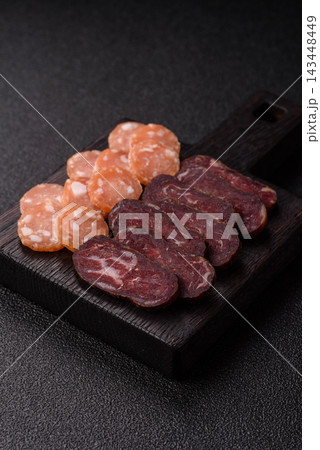 Sliced dry cured beef sausage or basturma with salt and spices. Sliced basturma Sliced dry cured beef sausage or basturma with salt and spices. Sliced basturma 143448449